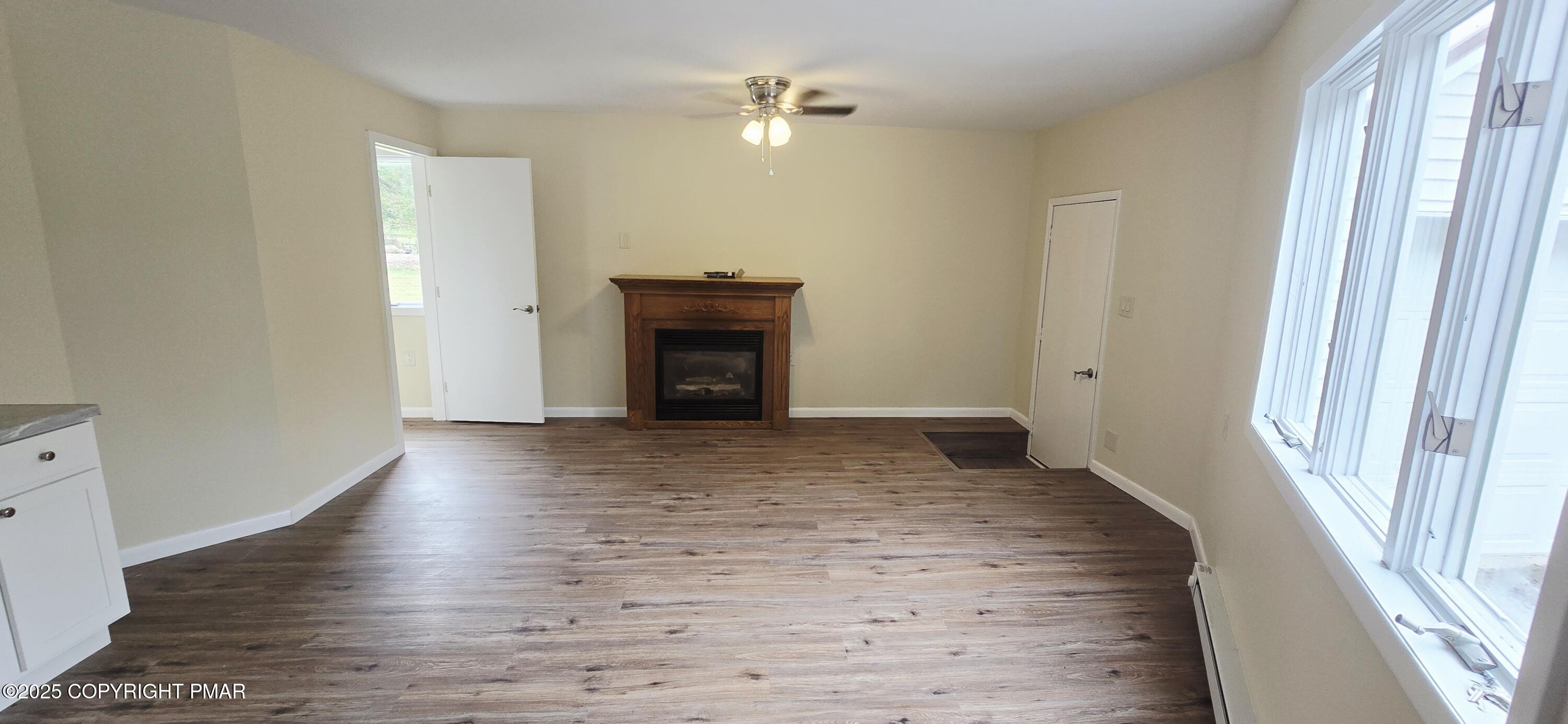 117 Rinker Road Stroudsburg, PA 18360 - Photo 33 of 33 a view of empty room with wooden floor and fan