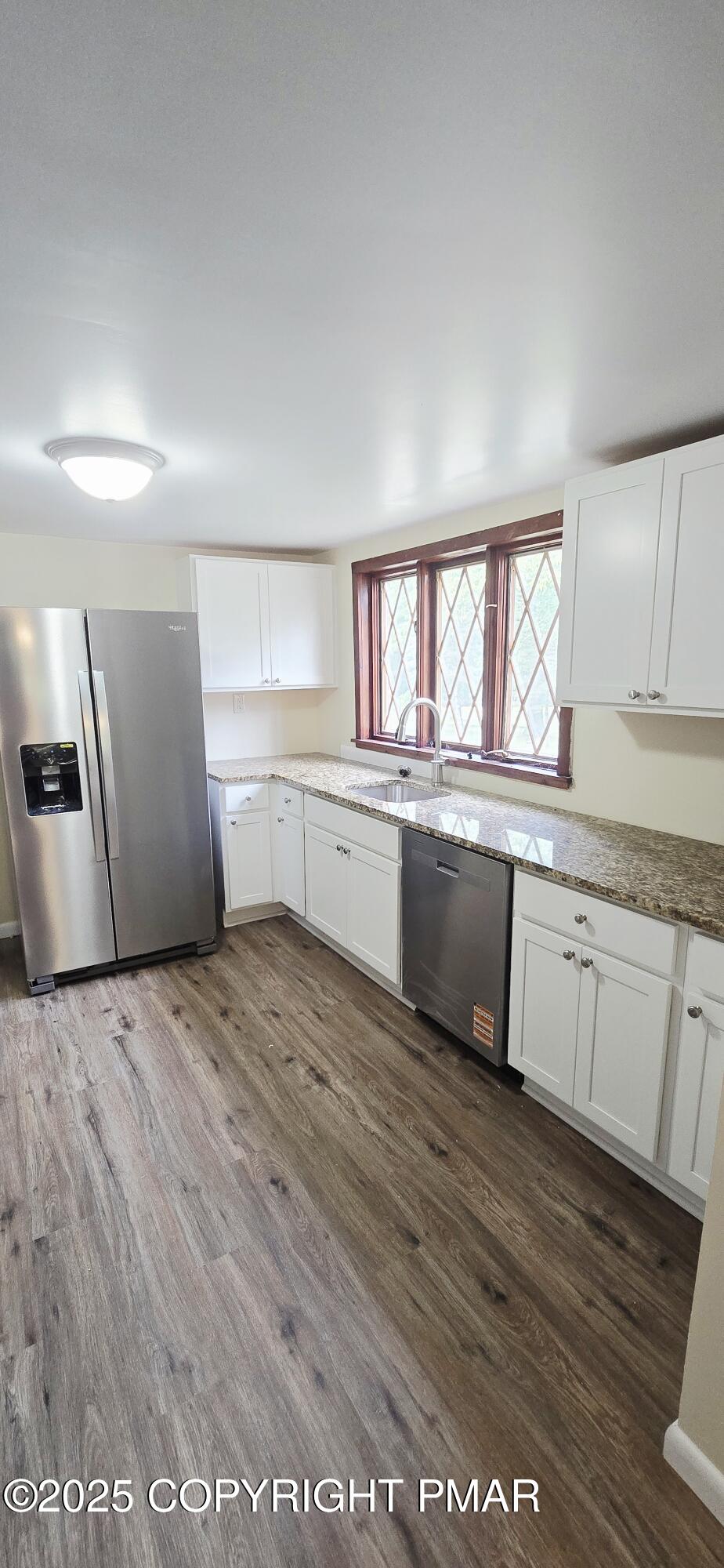 117 Rinker Road Stroudsburg, PA 18360 - Photo 8 of 33 a large kitchen with granite countertop a sink window and stainless steel appliances
