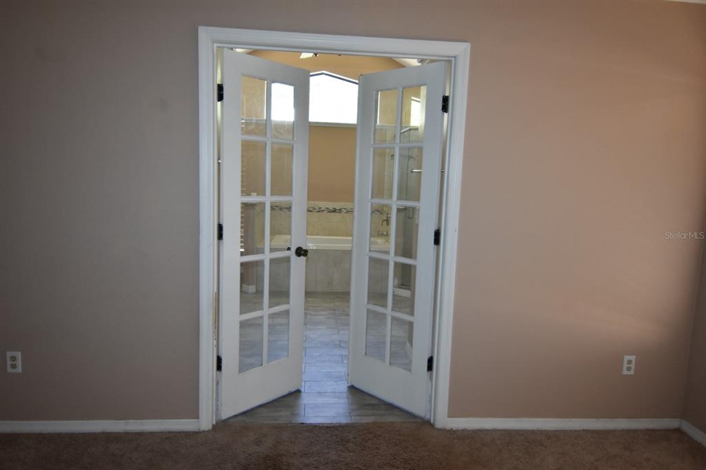678 Fairchild Avenue Deltona, FL 32725 - Photo 11 of 45 a view of a glass door and a porch