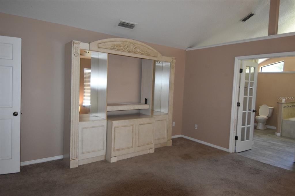 678 Fairchild Avenue Deltona, FL 32725 - Photo 12 of 45 a spacious bathroom with a mirror and a shower