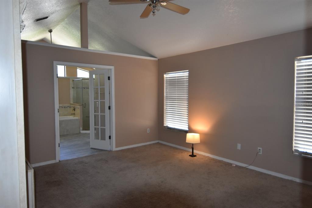 678 Fairchild Avenue Deltona, FL 32725 - Photo 13 of 45 a view of an empty room with a window