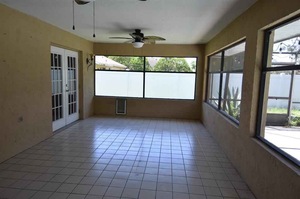 678 Fairchild Avenue Deltona, FL 32725 - Photo 20 of 45 a view of empty room with wooden floor and fan