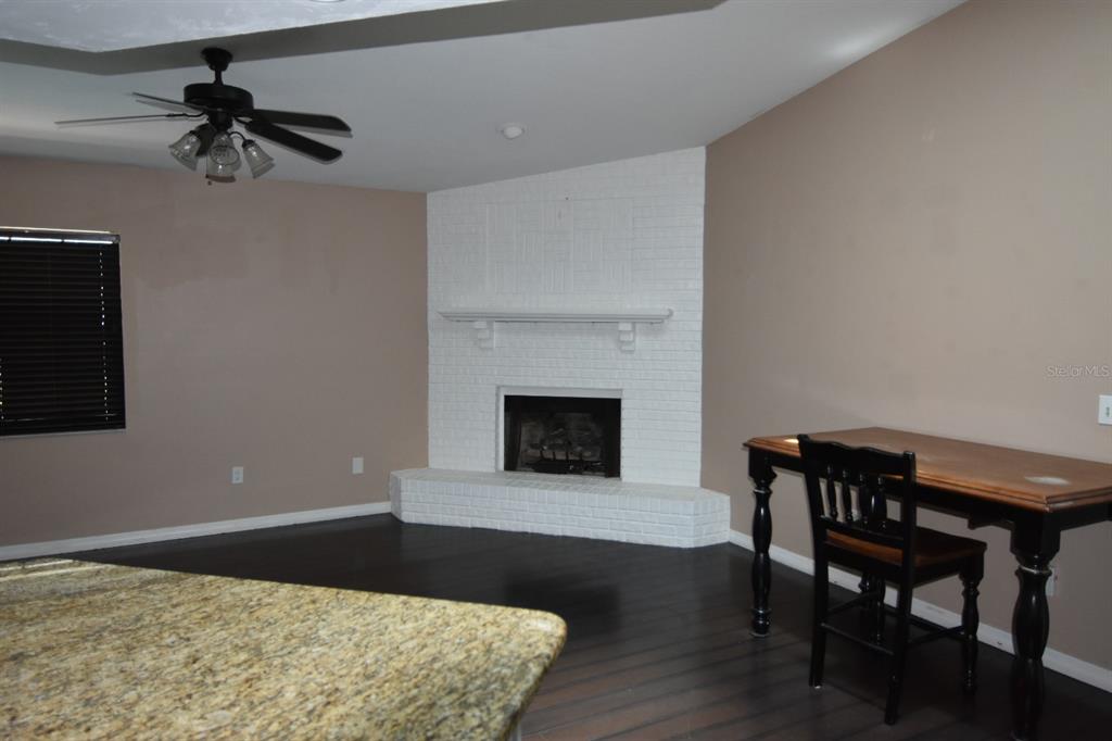 678 Fairchild Avenue Deltona, FL 32725 - Photo 21 of 45 a living room with furniture and a fireplace