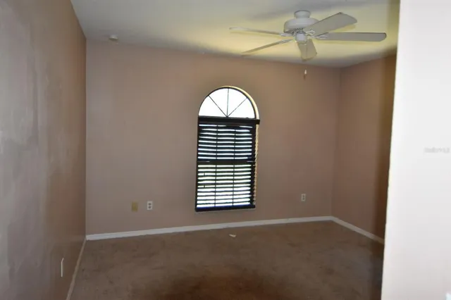 wooden floor in a hall with a window