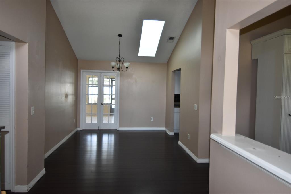 678 Fairchild Avenue Deltona, FL 32725 - Photo 29 of 45 wooden floor in a hall with a window