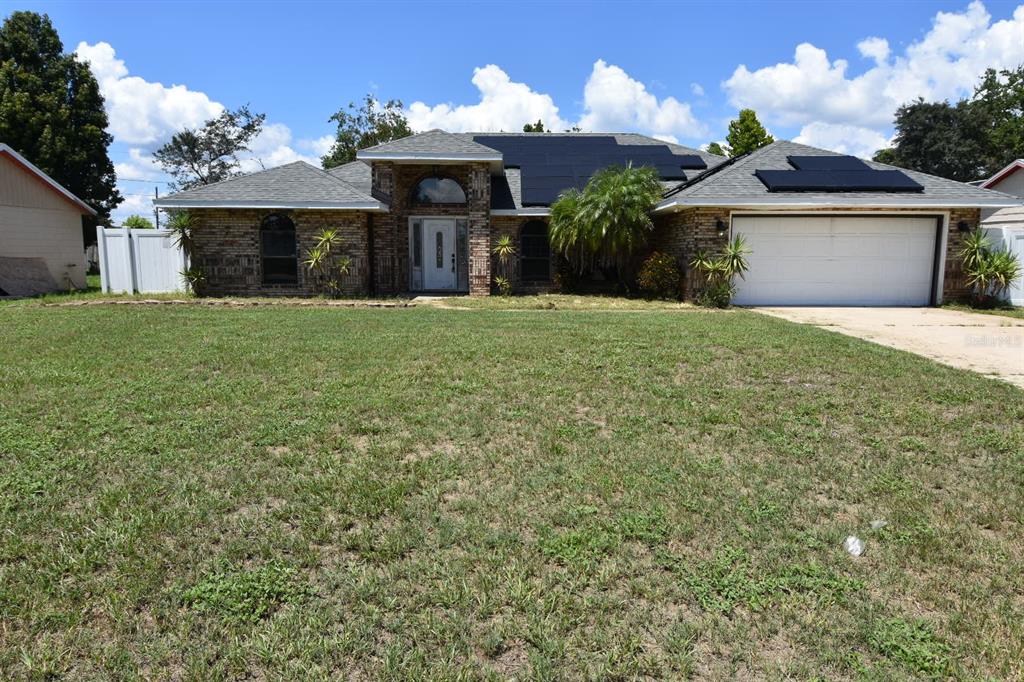 678 Fairchild Avenue Deltona, FL 32725 - Photo 31 of 45 a front view of a house with garden