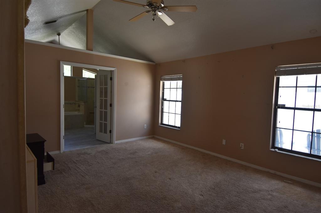 678 Fairchild Avenue Deltona, FL 32725 - Photo 33 of 45 an empty room with windows and closet