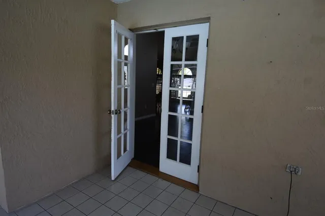 a view of empty room with windows