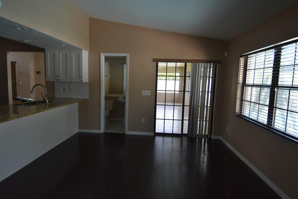678 Fairchild Avenue Deltona, FL 32725 - Photo 39 of 45 a view of a room window and wooden floor