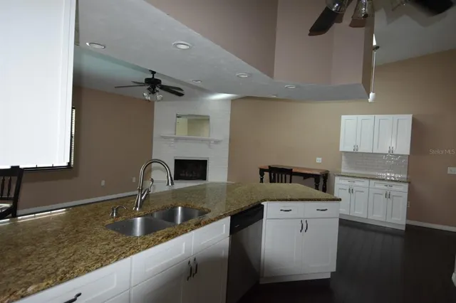 a kitchen with a refrigerator stove and microwave