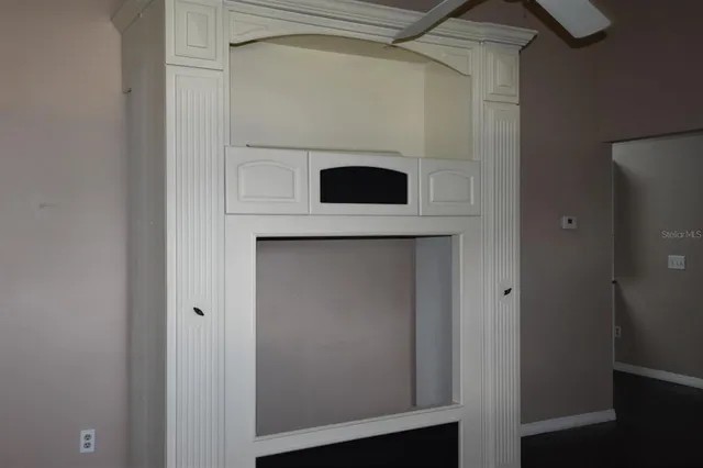 a view of cabinet and utility room