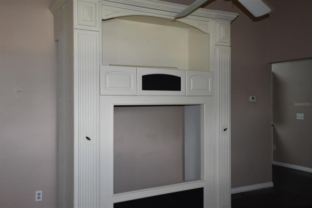 678 Fairchild Avenue Deltona, FL 32725 - Photo 4 of 45 a view of cabinet and utility room