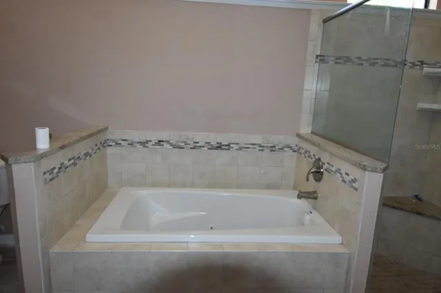 a bathroom with a sink and shower