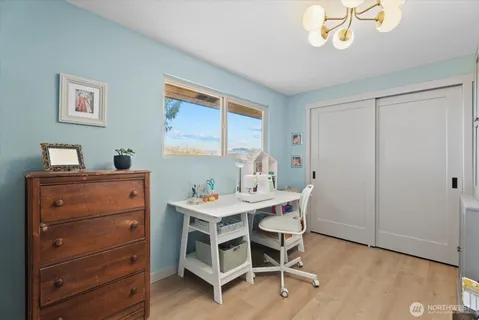 a view of a workspace with furniture