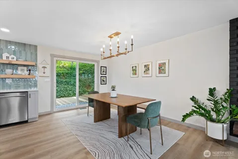 a view of a dining room with furniture window and wooden floor
