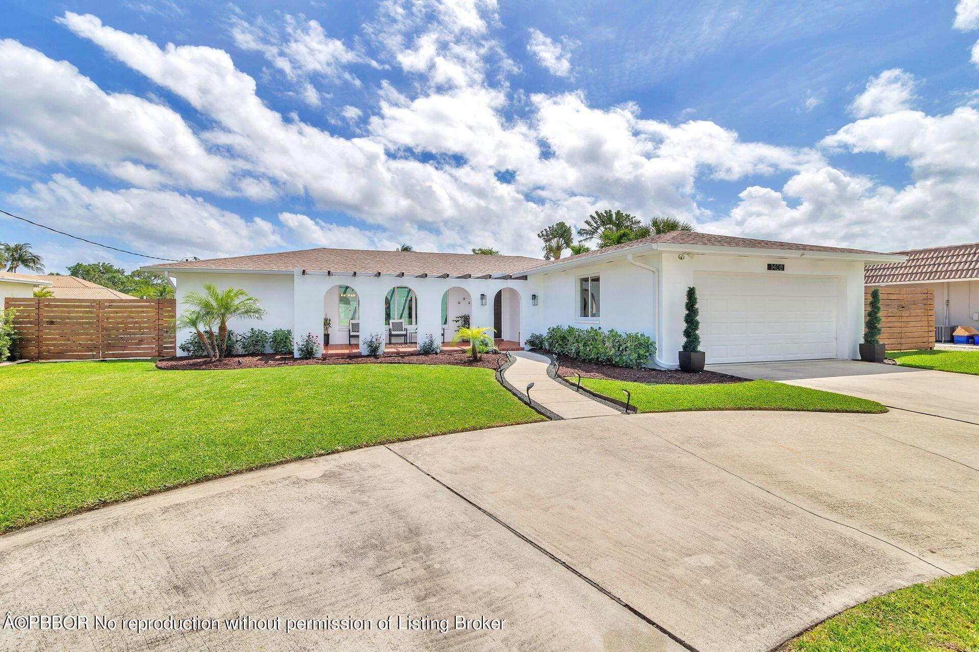 1408 Indian Road East West Palm Beach, FL 33406 - Photo 1 of 50 a view of yard with swimming pool and green space