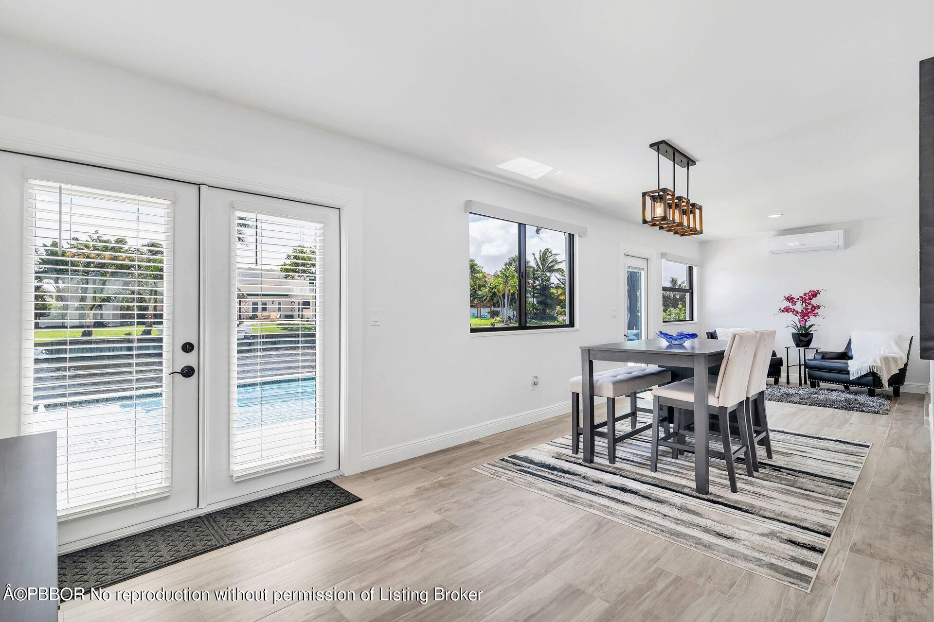 1408 Indian Road East West Palm Beach, FL 33406 - Photo 17 of 50 a view of a dining room with furniture window and outside view