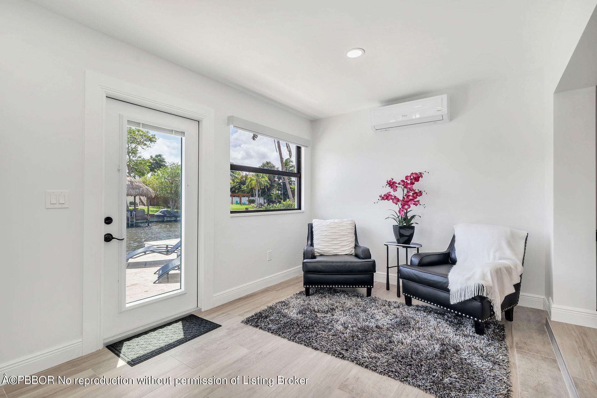 1408 Indian Road East West Palm Beach, FL 33406 - Photo 19 of 50 a living room with furniture and a window