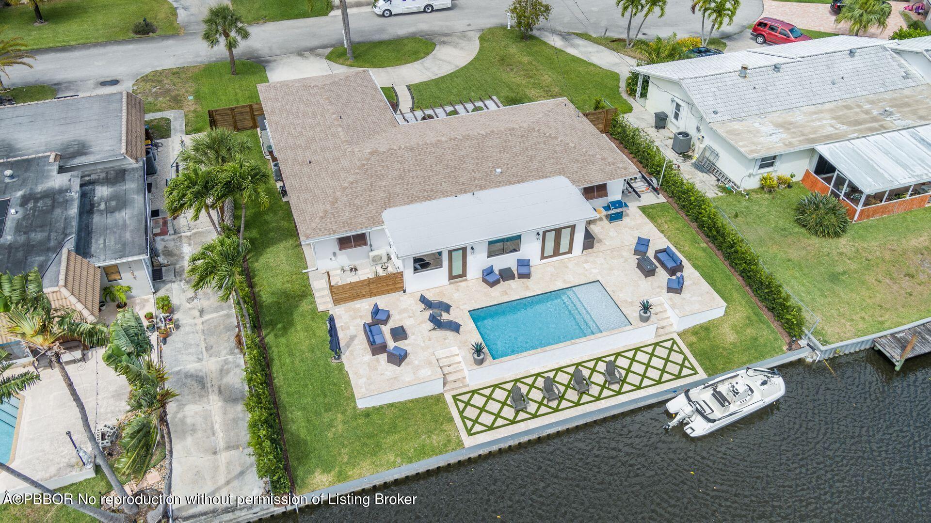 1408 Indian Road East West Palm Beach, FL 33406 - Photo 2 of 50 an aerial view of residential houses with outdoor space