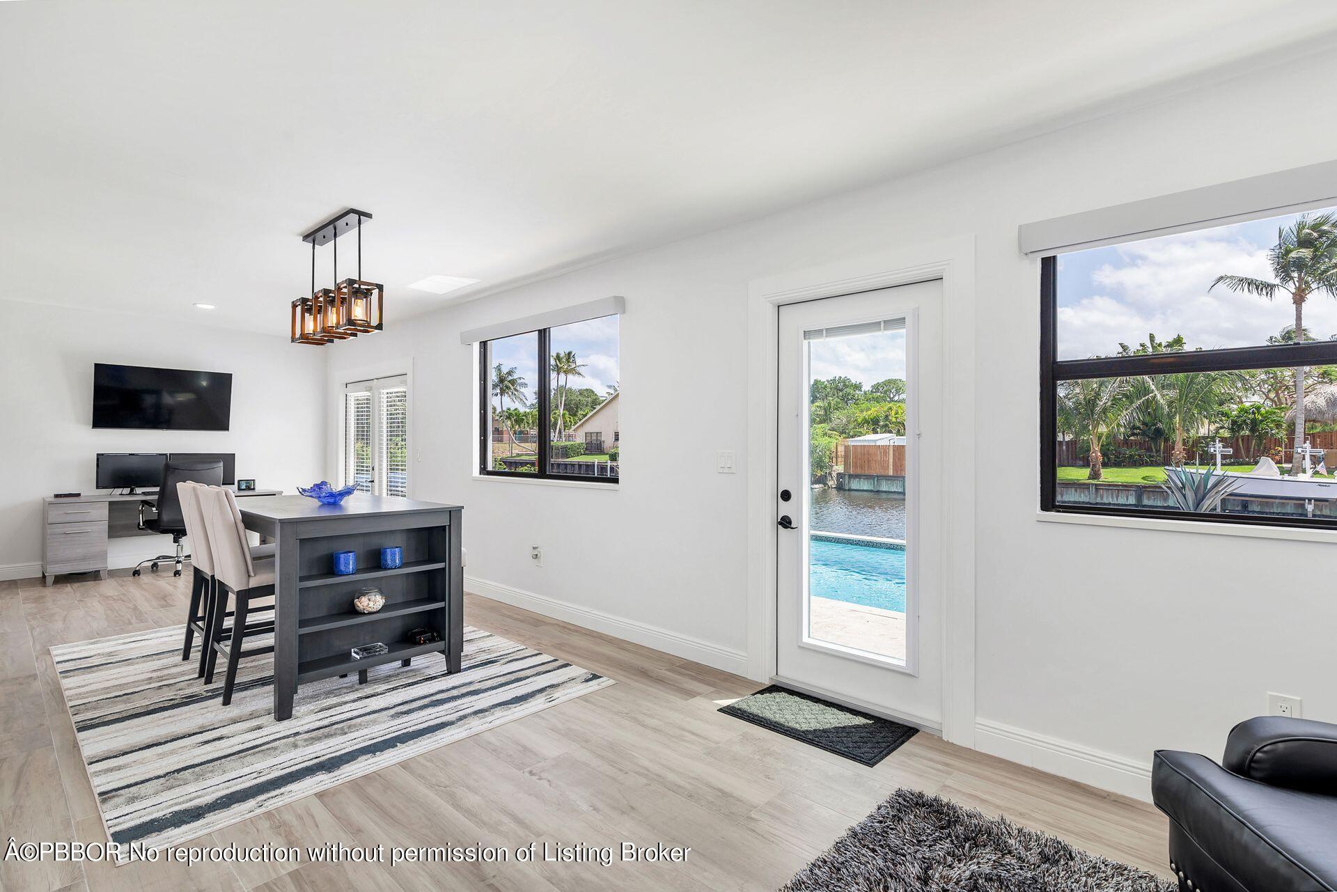 1408 Indian Road East West Palm Beach, FL 33406 - Photo 21 of 50 a living room with furniture and a window