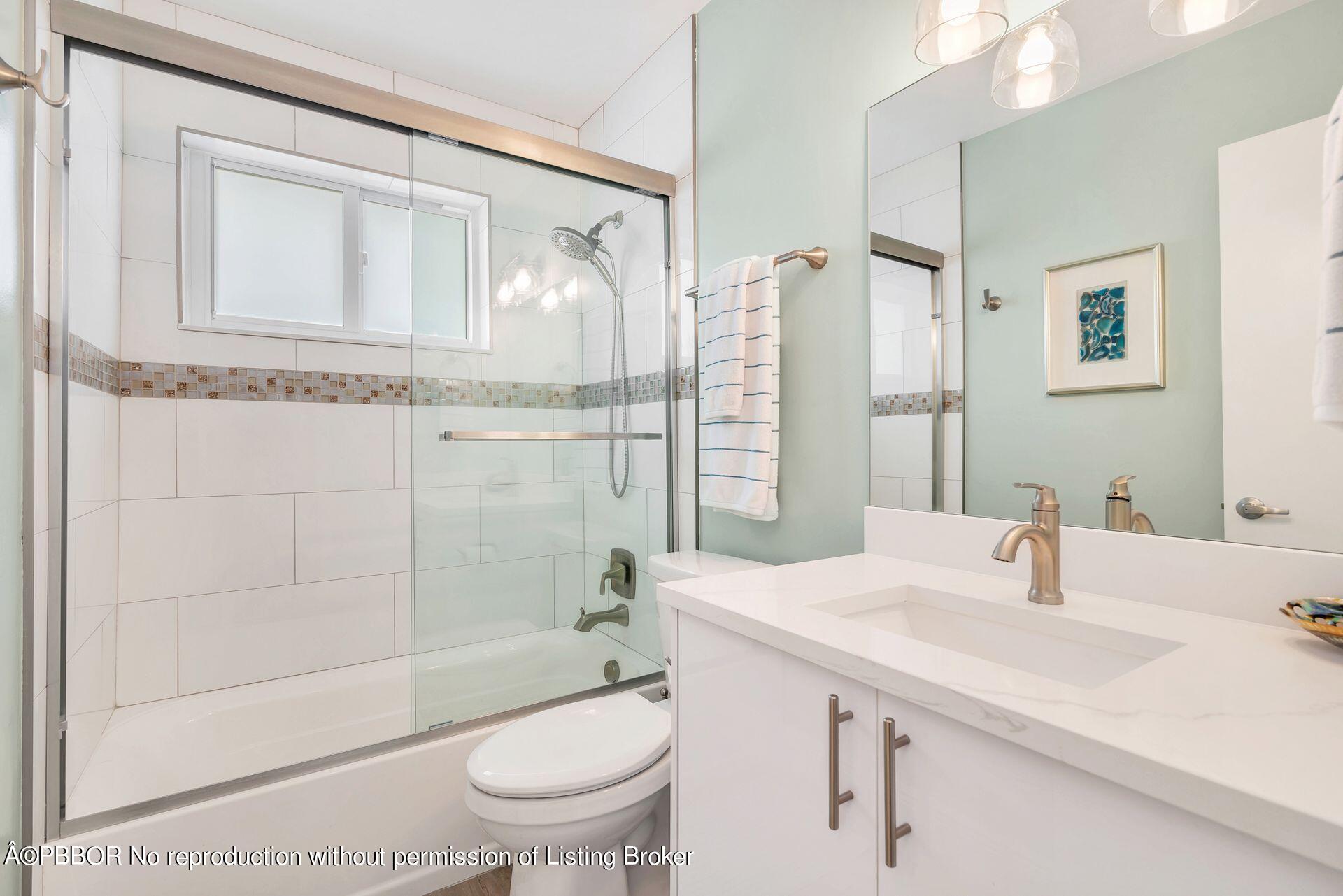 1408 Indian Road East West Palm Beach, FL 33406 - Photo 26 of 50 a bathroom with a sink a toilet and shower