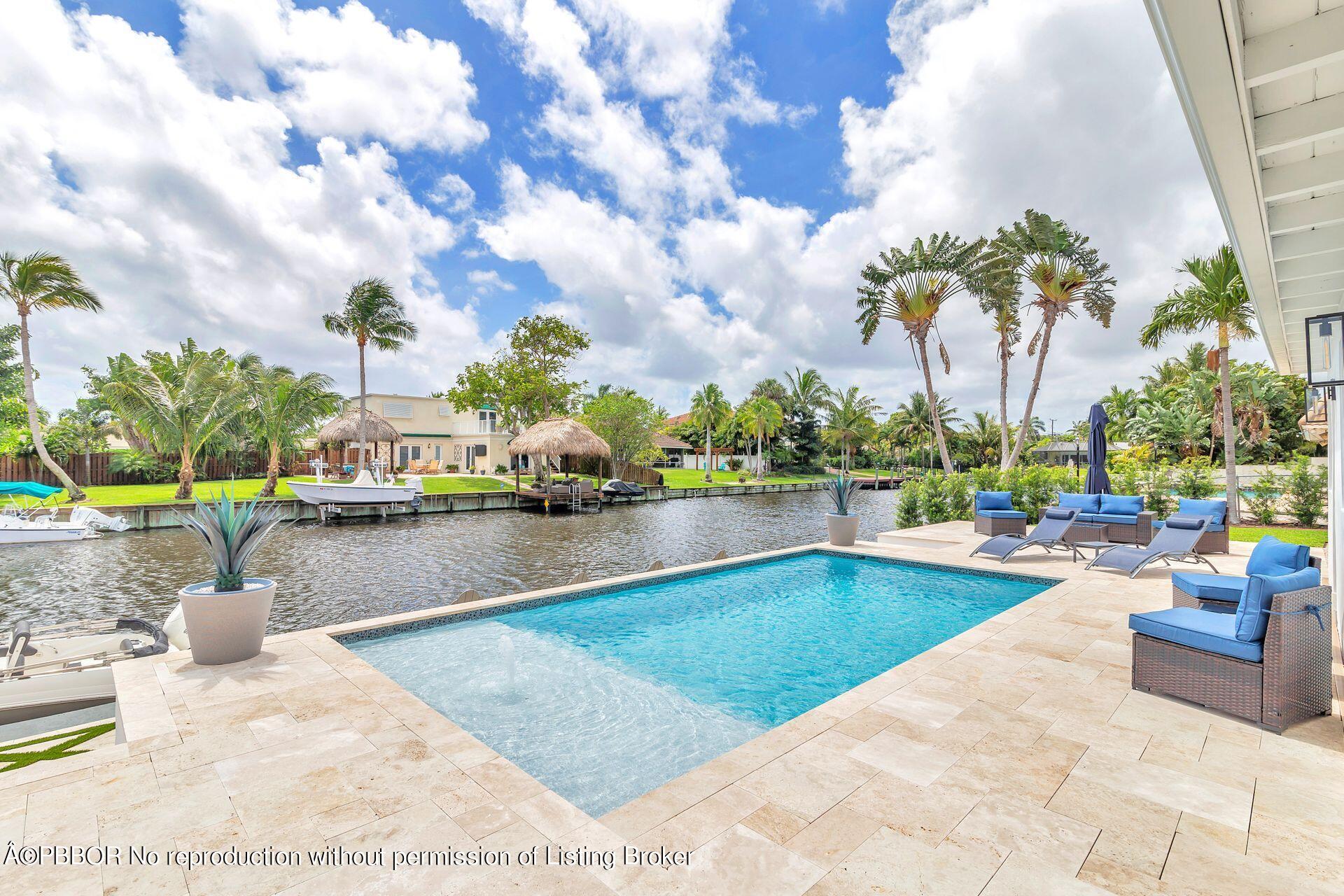 1408 Indian Road East West Palm Beach, FL 33406 - Photo 31 of 50 a view of swimming pool with outdoor seating