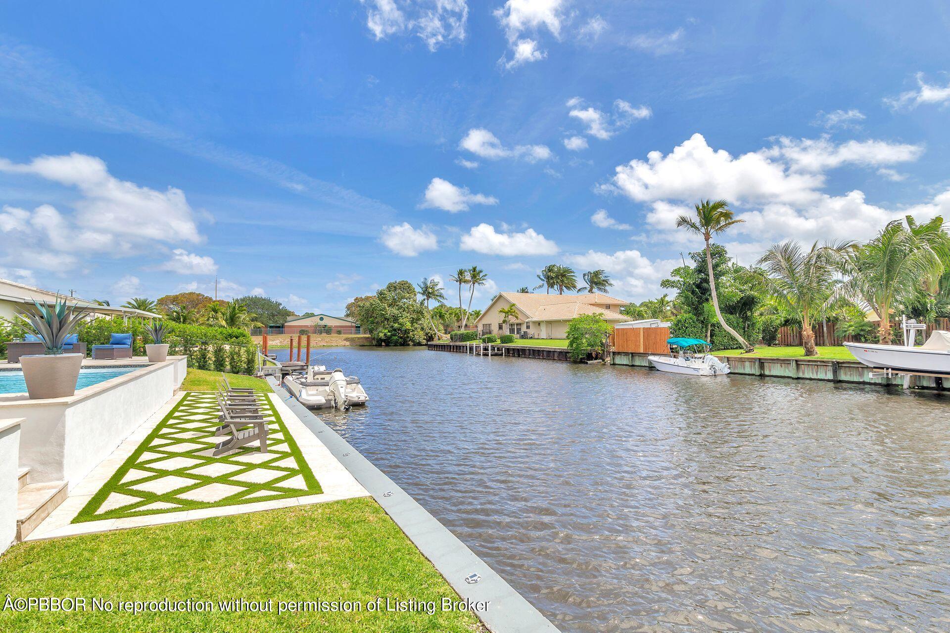 1408 Indian Road East West Palm Beach, FL 33406 - Photo 37 of 50 a view of a swimming pool with a lake view