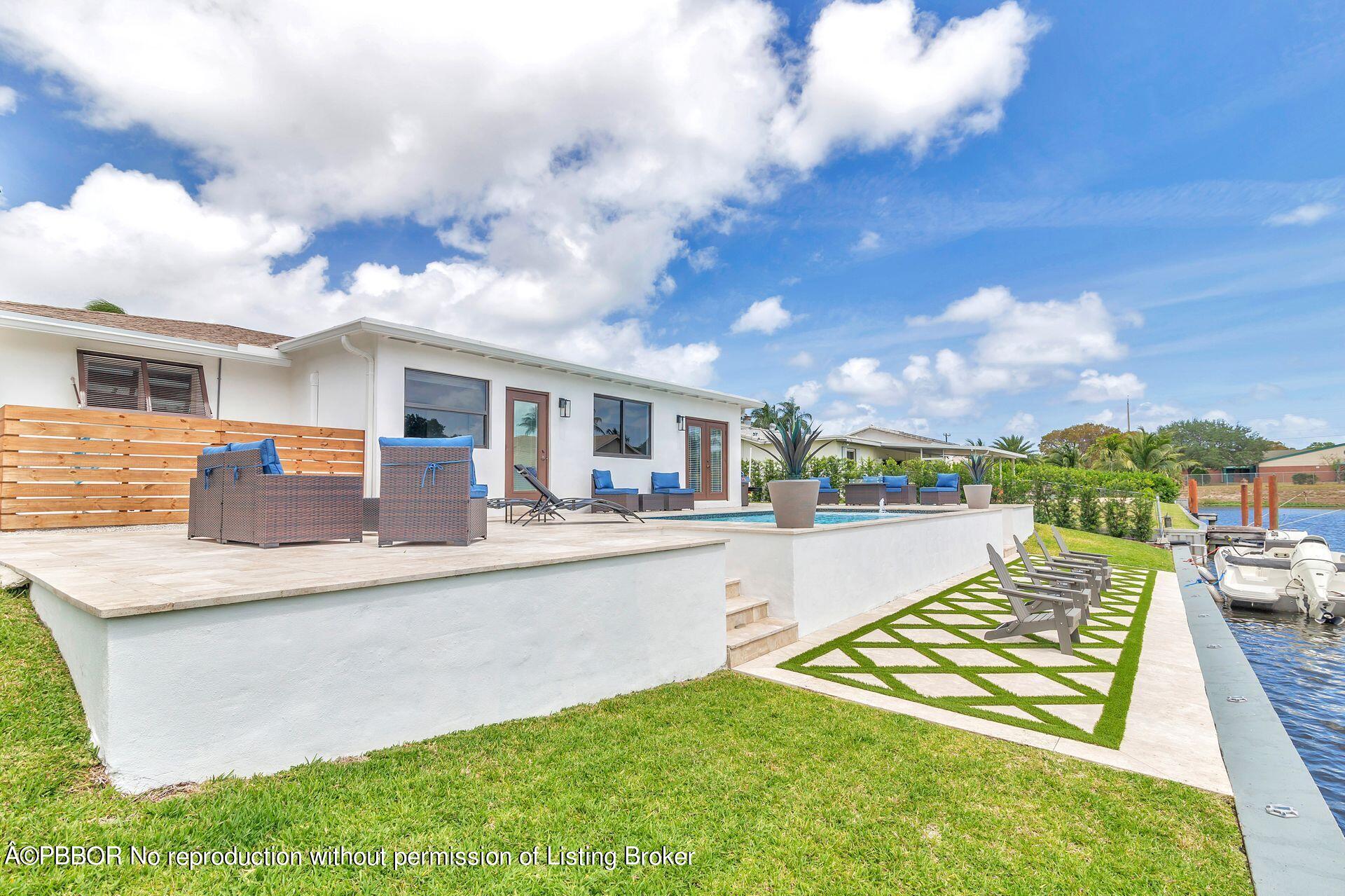 1408 Indian Road East West Palm Beach, FL 33406 - Photo 38 of 50 a view of a house with swimming pool and sitting area