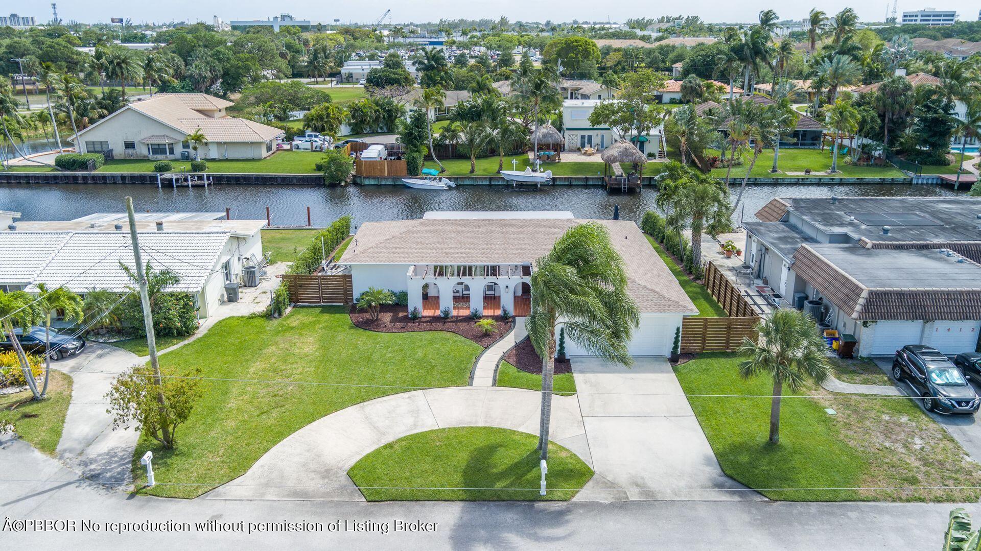 1408 Indian Road East West Palm Beach, FL 33406 - Photo 43 of 50 an aerial view of a house with swimming pool garden and patio