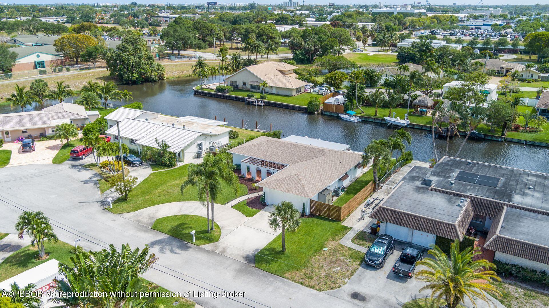 1408 Indian Road East West Palm Beach, FL 33406 - Photo 44 of 50 an aerial view of a house with a lake view