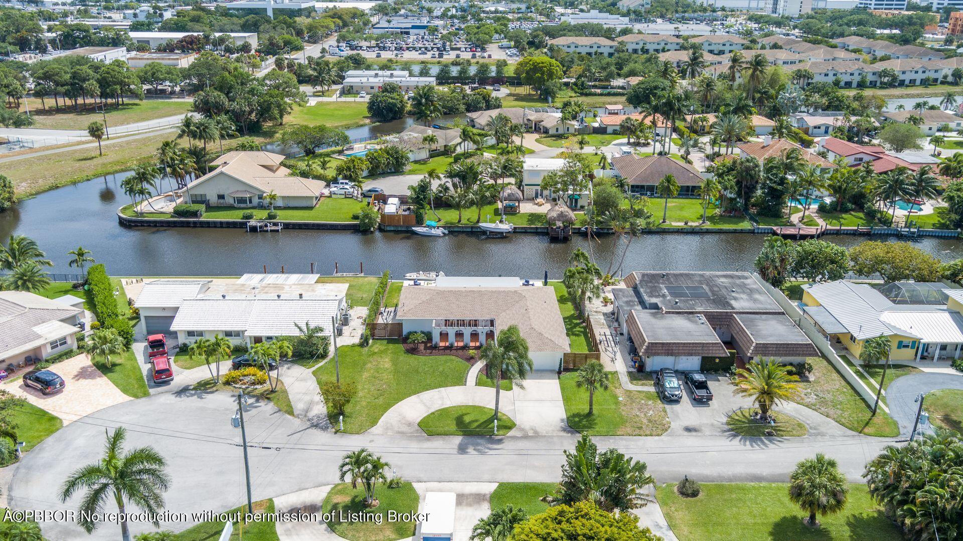 1408 Indian Road East West Palm Beach, FL 33406 - Photo 45 of 50 an aerial view of lake and residential houses with outdoor space