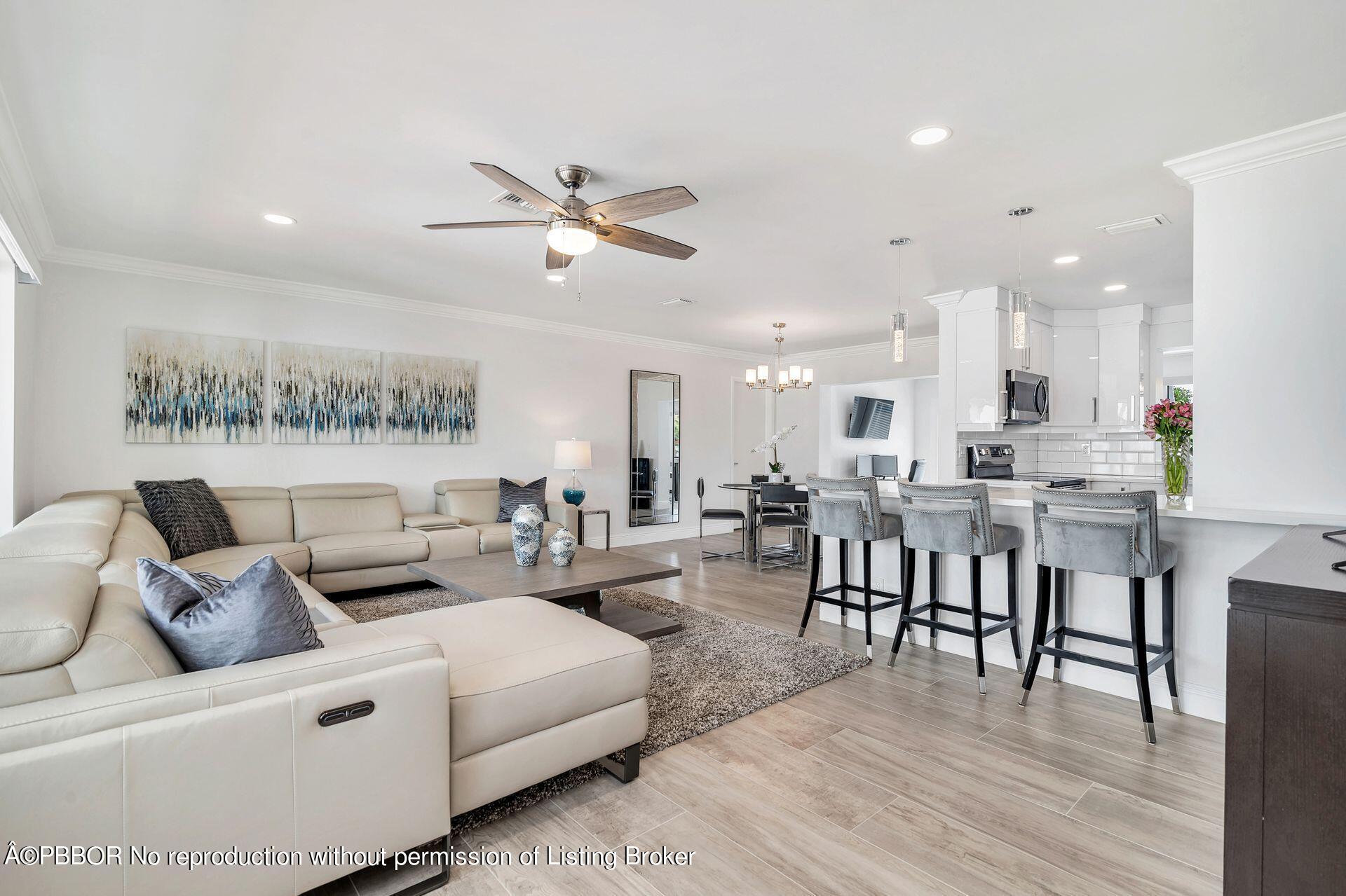 1408 Indian Road East West Palm Beach, FL 33406 - Photo 5 of 50 a living room with furniture kitchen view and a wooden floor