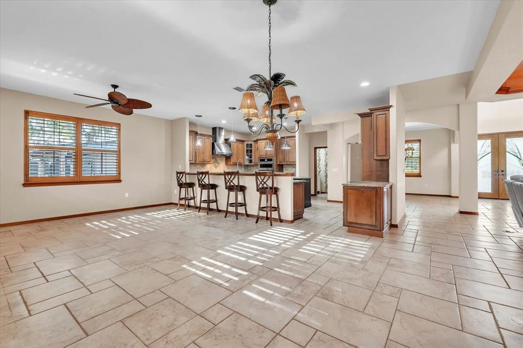 10597 Southwest Kissimmee Road Arcadia, FL 34269 - Photo 13 of 54 a view of a living room and kitchen with windows
