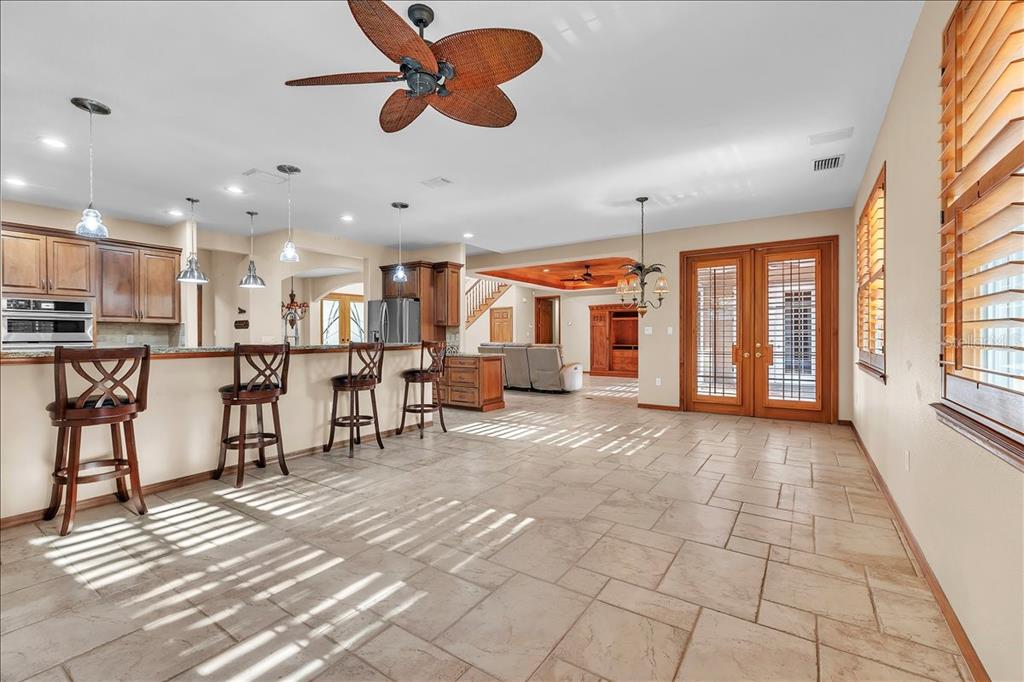 10597 Southwest Kissimmee Road Arcadia, FL 34269 - Photo 14 of 54 a view of a kitchen with dining space and windows