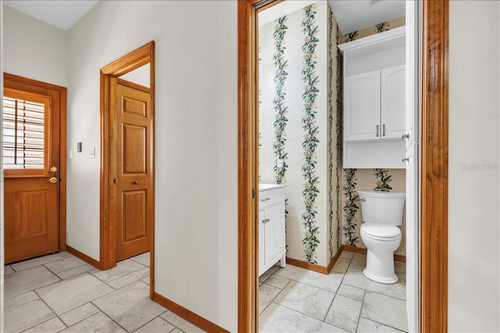 10597 Southwest Kissimmee Road Arcadia, FL 34269 - Photo 26 of 54 a bathroom with a granite countertop toilet and a shower