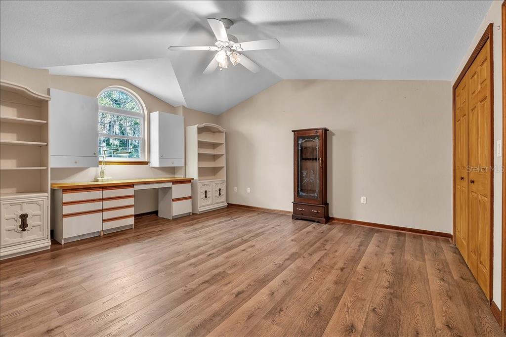 10597 Southwest Kissimmee Road Arcadia, FL 34269 - Photo 38 of 54 wooden floor in an empty room with a window
