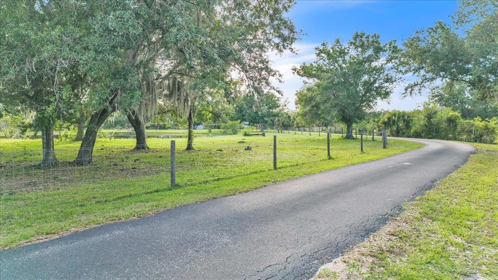 10597 Southwest Kissimmee Road Arcadia, FL 34269 - Photo 4 of 54 a view of a park with large trees