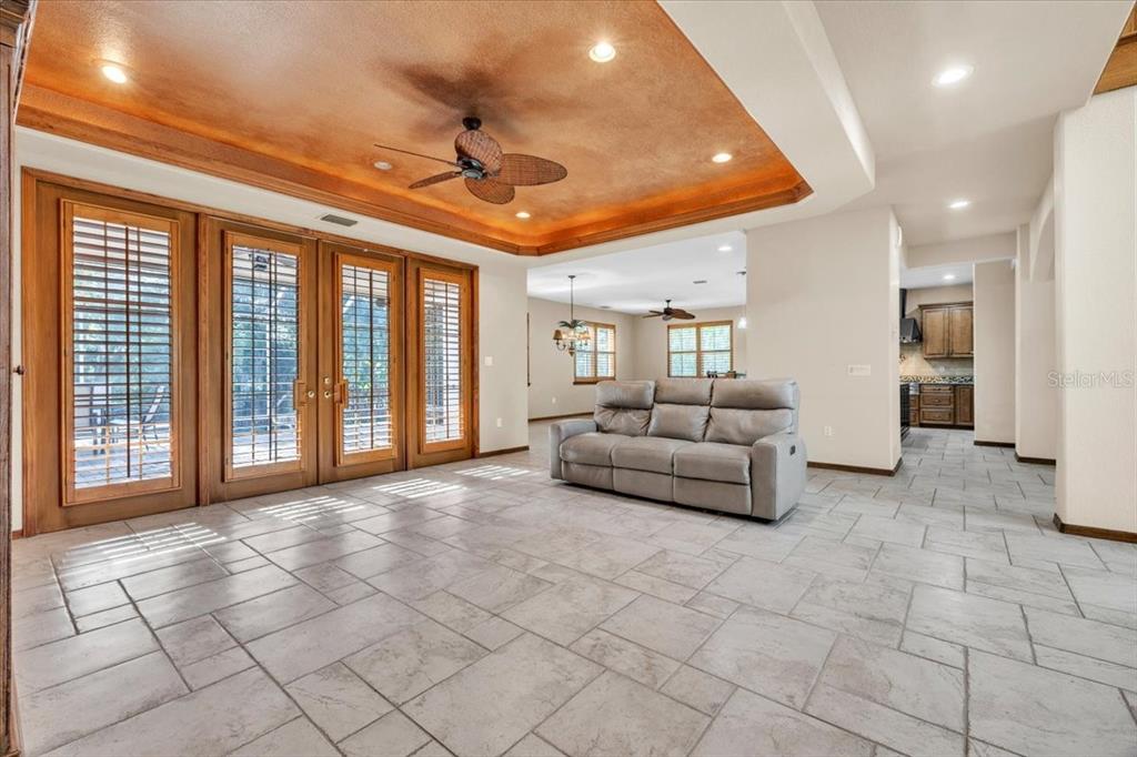 10597 Southwest Kissimmee Road Arcadia, FL 34269 - Photo 10 of 54 a living room with furniture and a large window