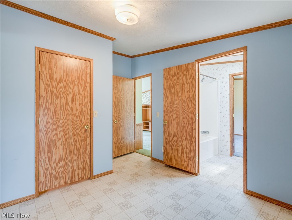 4080 Johnson Road Norton, OH 44203 - Photo 5 of 33 foyer with lighted closet and access to bathroom and both living spaces