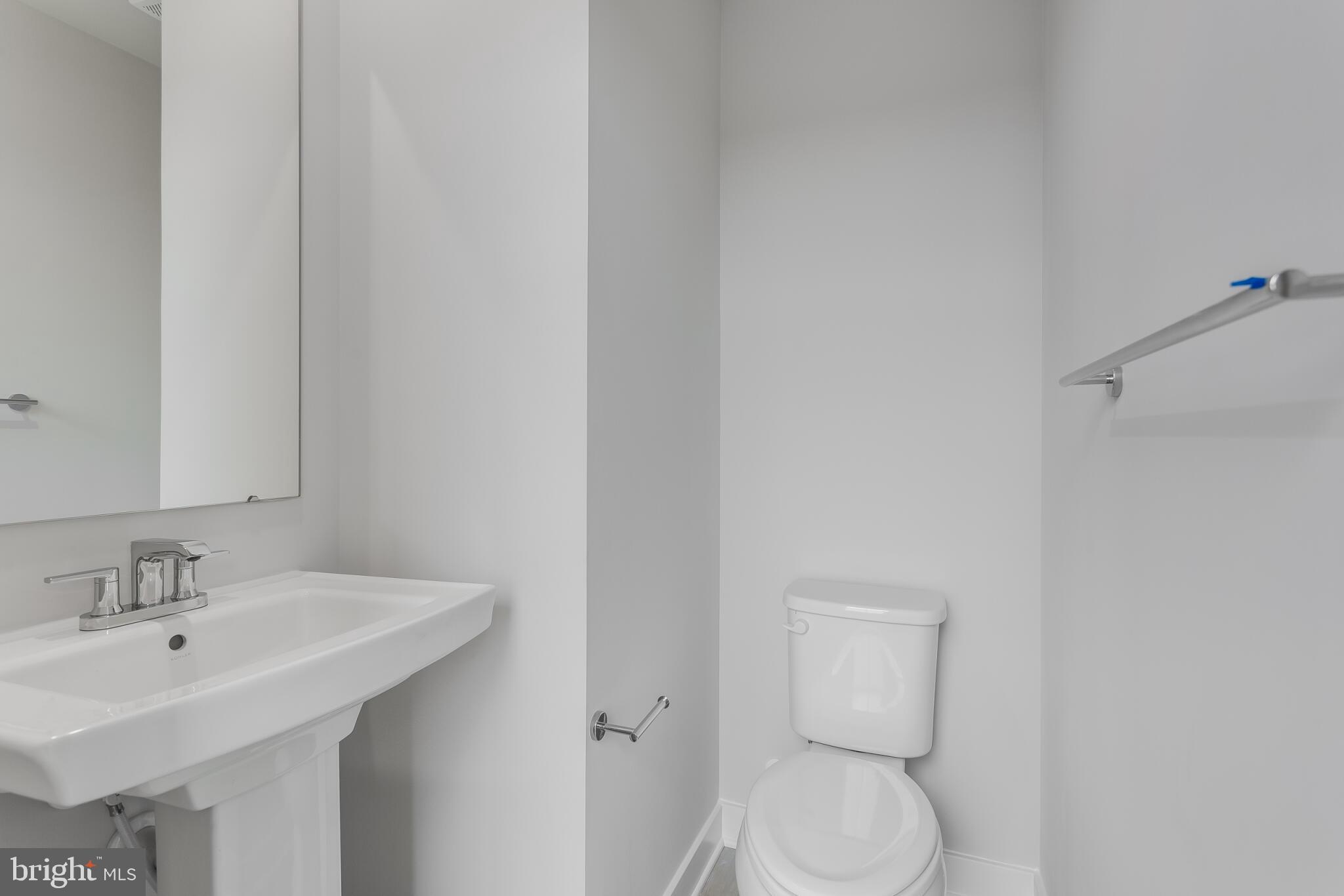 1733 Destrier Street Ranson, WV 25438 - Photo 11 of 22 a bathroom with a toilet sink and mirror