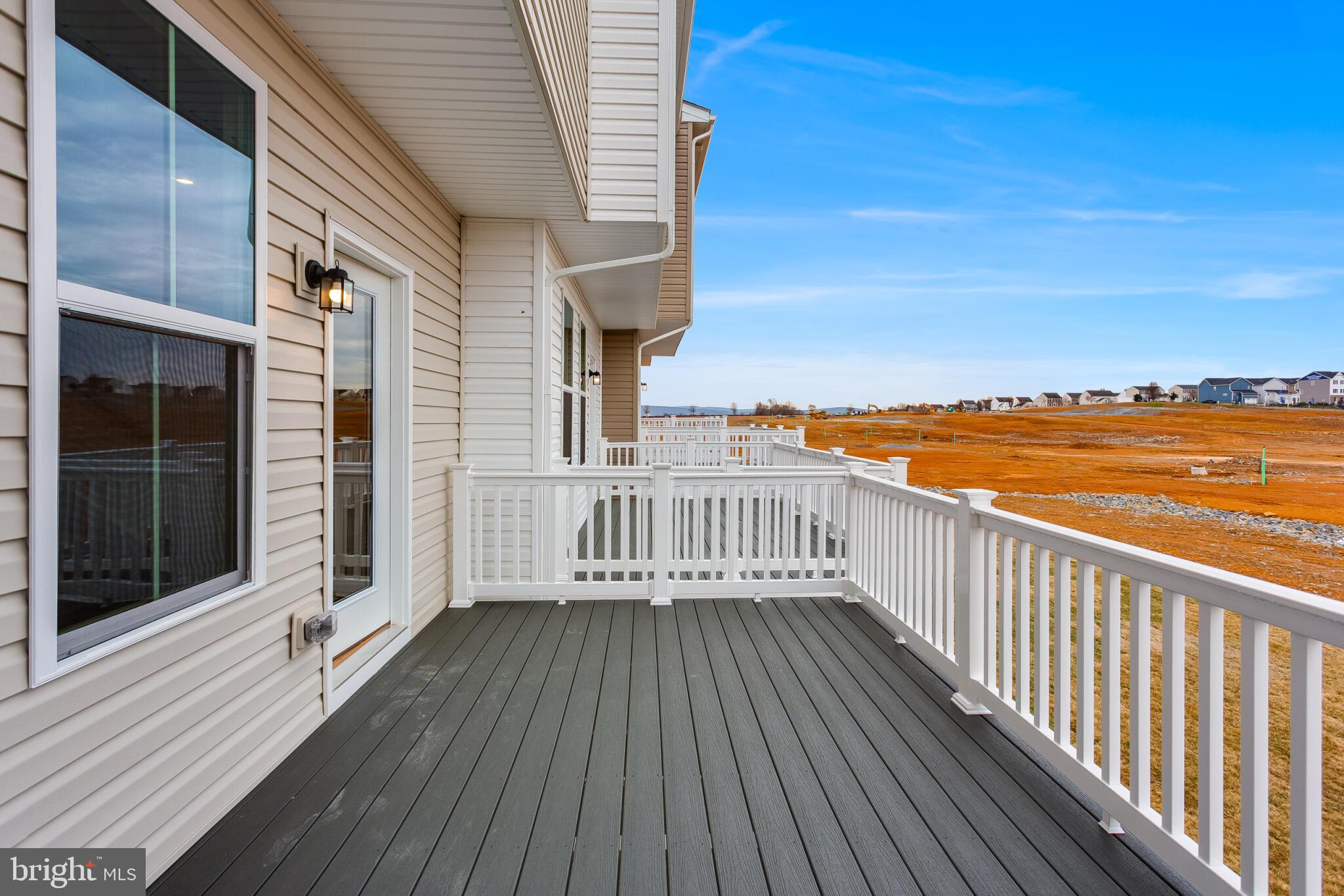 1733 Destrier Street Ranson, WV 25438 - Photo 12 of 22 a view of a balcony with wooden floor and city view
