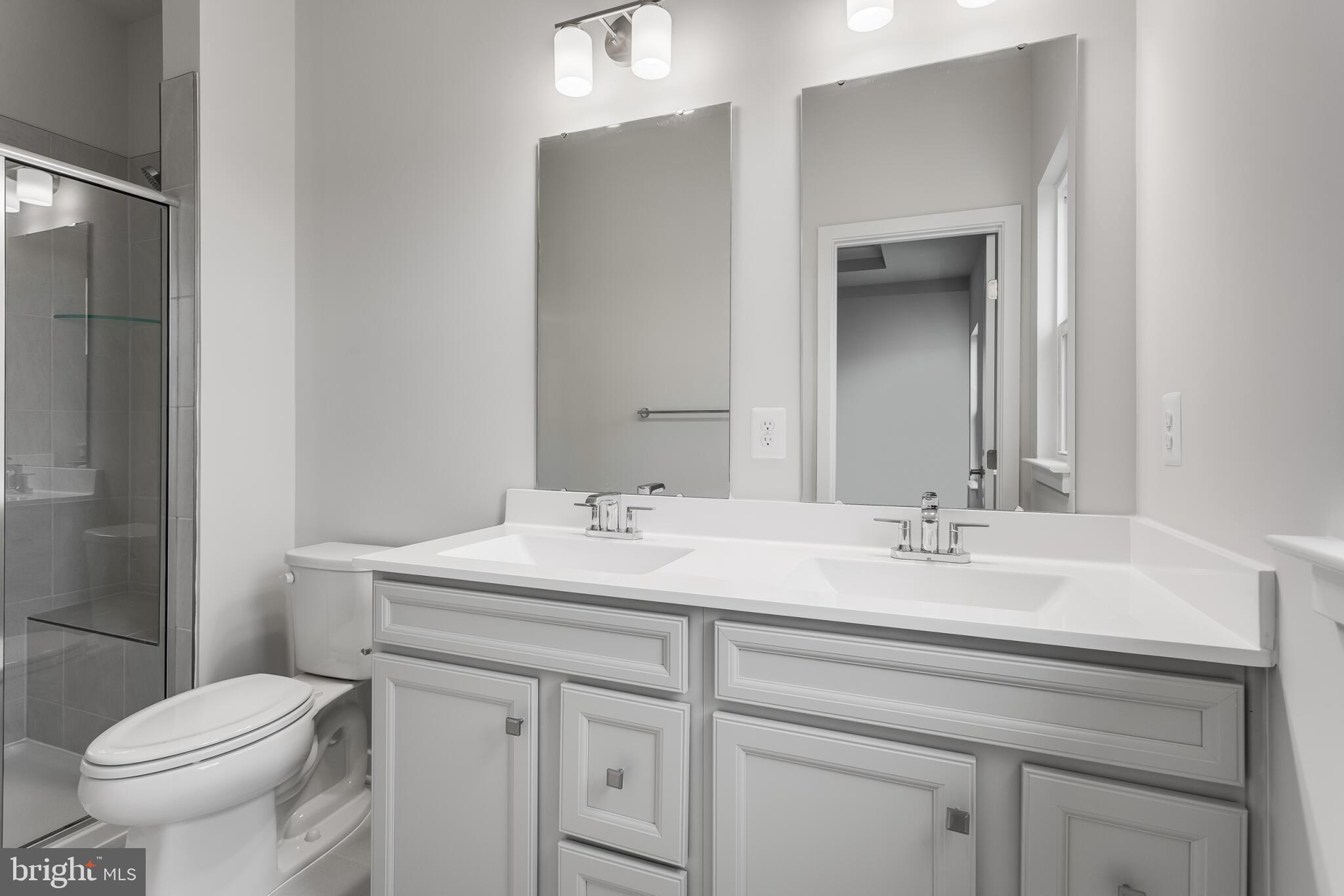 1733 Destrier Street Ranson, WV 25438 - Photo 21 of 22 a bathroom with a sink toilet and mirror