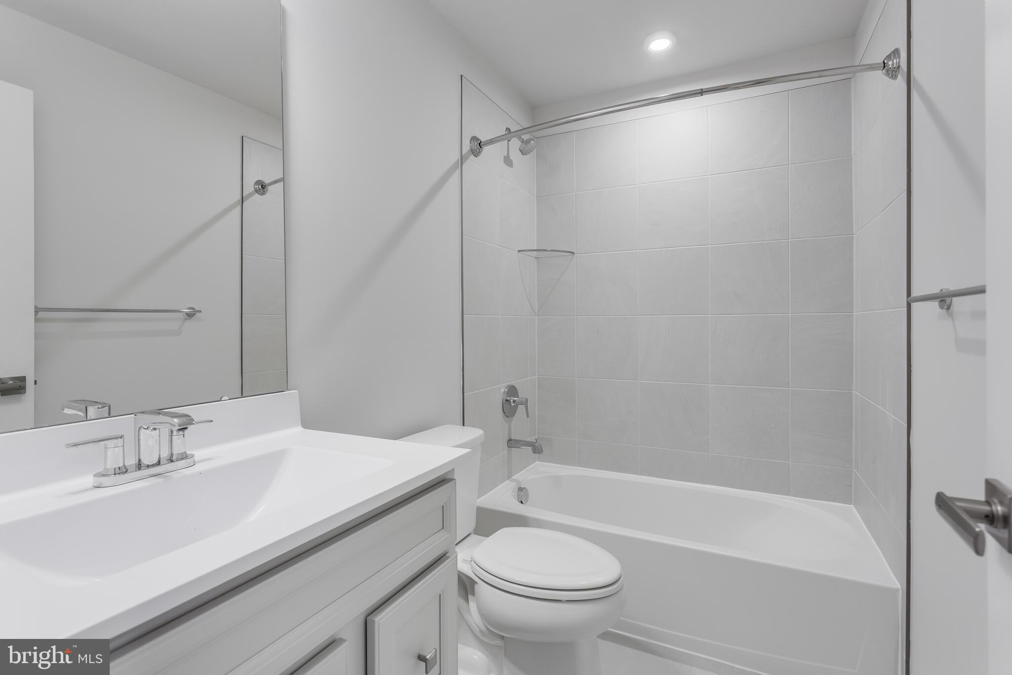 1733 Destrier Street Ranson, WV 25438 - Photo 4 of 22 a bathroom with a sink toilet and shower