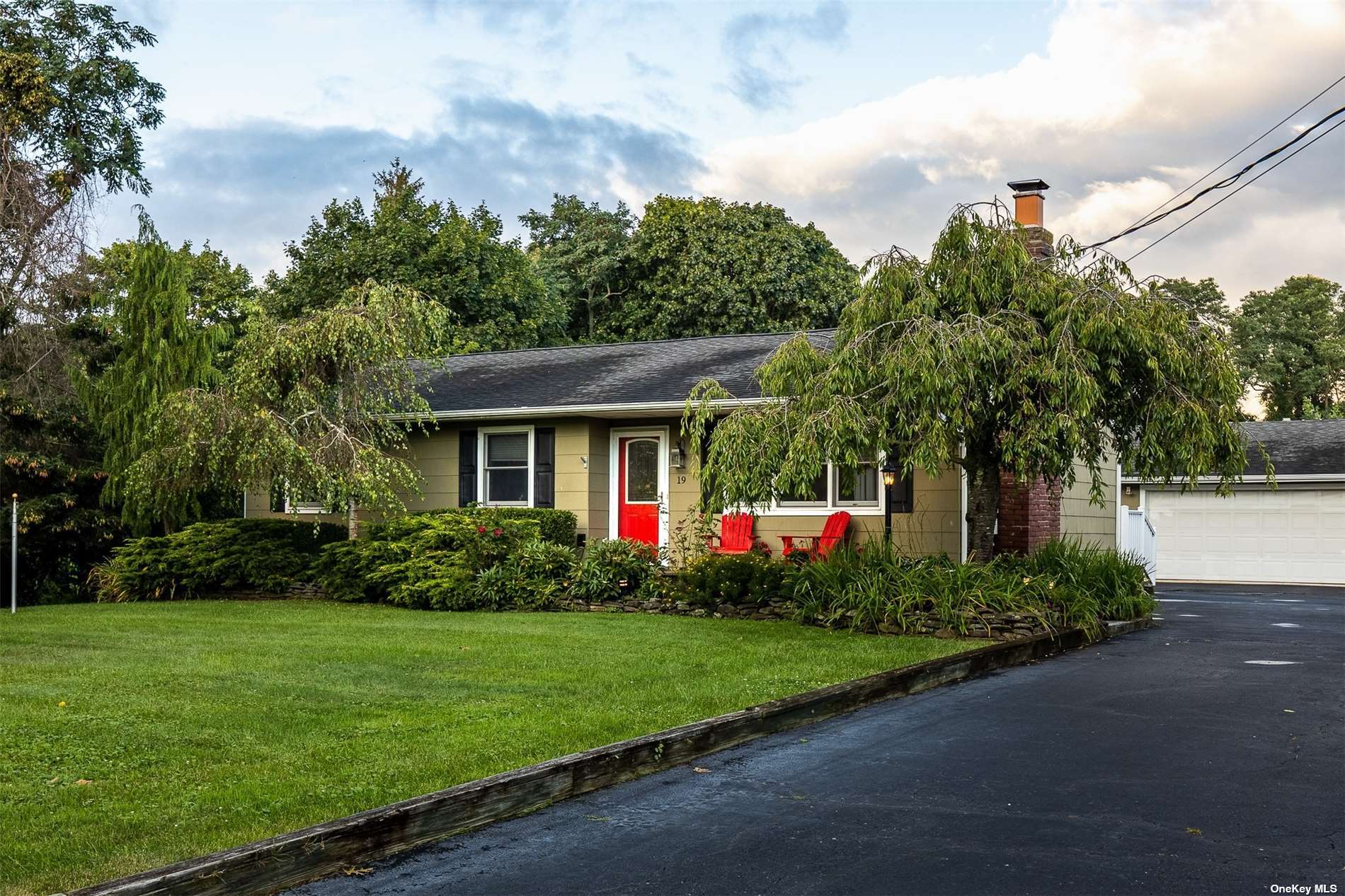 19 Fuoco Road Bellport, NY 11713 - Photo 1 of 1 a front view of house with yard and green space