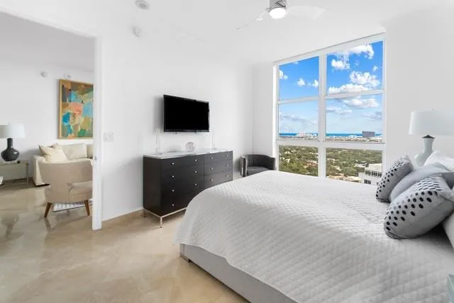 a bathroom with a shower sink and mirror