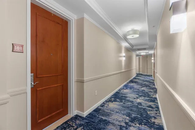 a view of kitchen with furniture and refrigerator