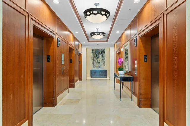 a view of a patio with table and chairs and potted plants