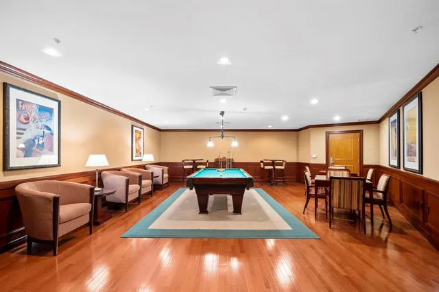 a swimming pool with outdoor seating and yard