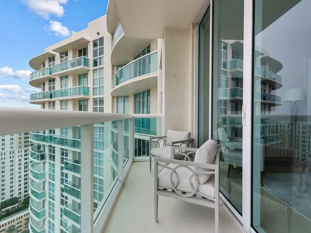 a view of a city skyline from a balcony