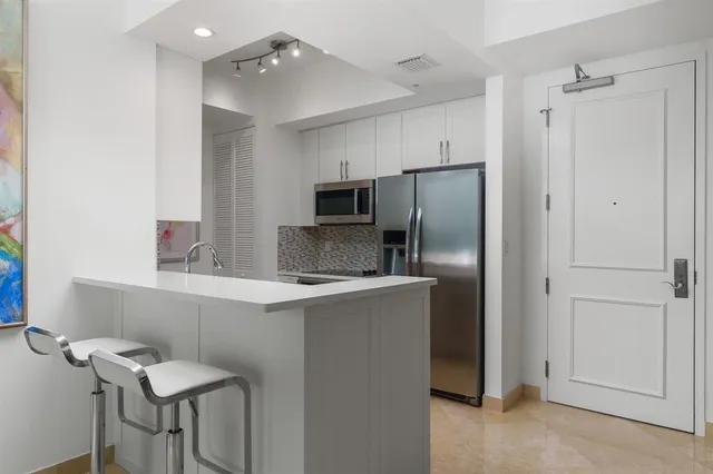 a kitchen with a stove and a microwave